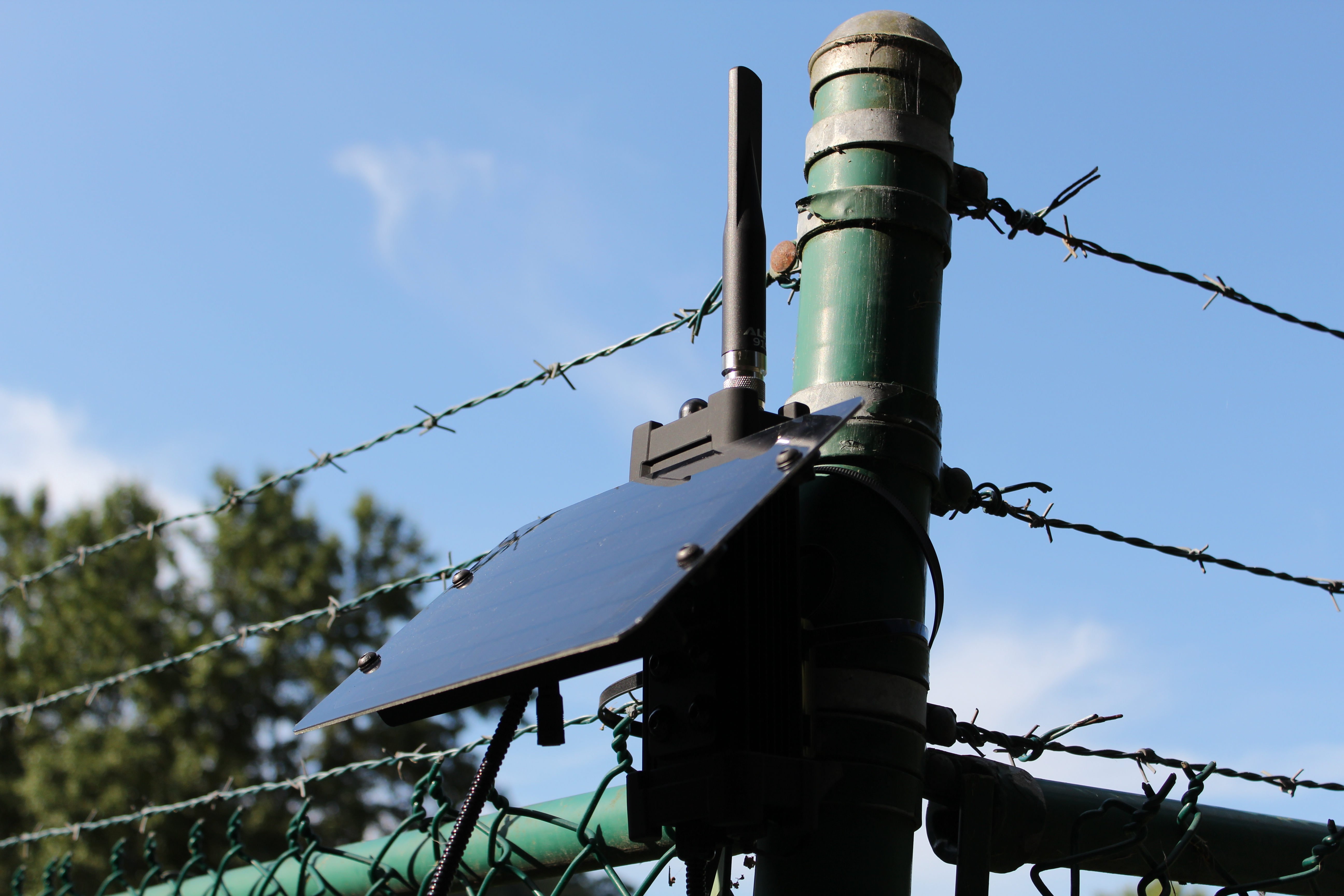 RM-1 Infrastructure variant mounted on fence post with solar panel